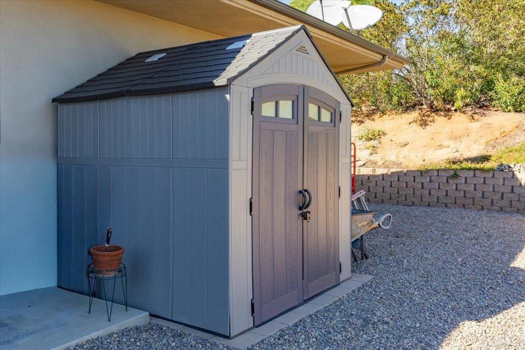5382 Willman Way Fallbrook, CA 92028 - Photo 62 of 64 a view of a wooden house with a yard