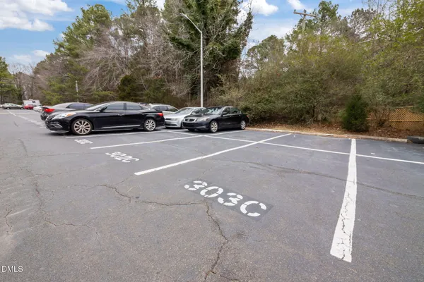 a view of cars parked on the side of a street
