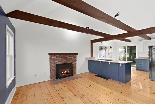 a bedroom with a bed and a fireplace