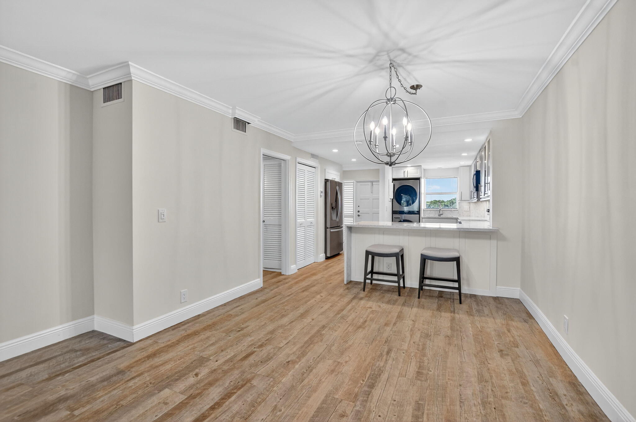 1040 Banyan Road, Unit 3050 Boca Raton, FL 33432 - Photo 12 of 35 a view of a dining room with furniture window and wooden floor