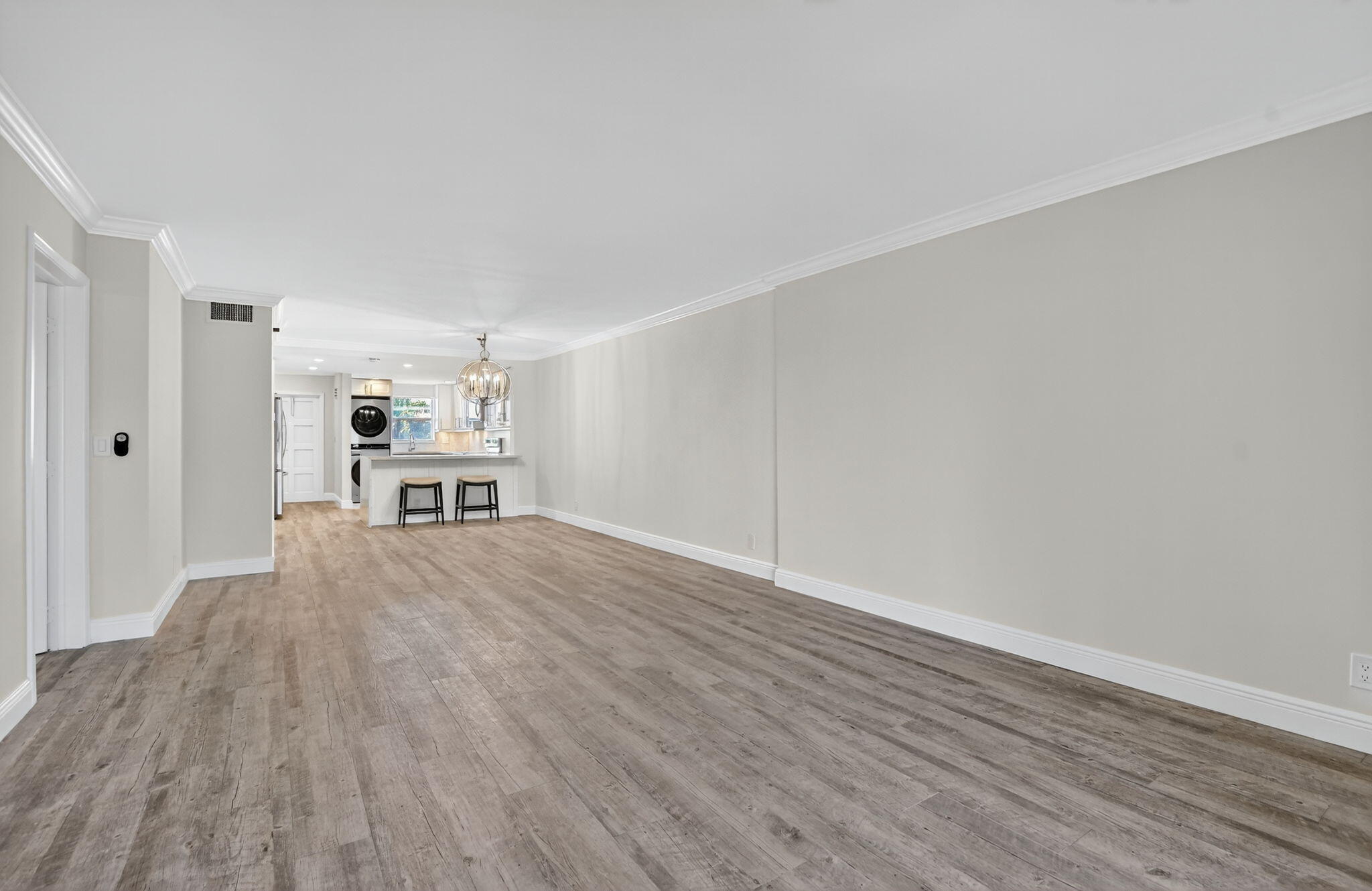 1040 Banyan Road, Unit 3050 Boca Raton, FL 33432 - Photo 18 of 35 a big room with wooden floor closet and windows