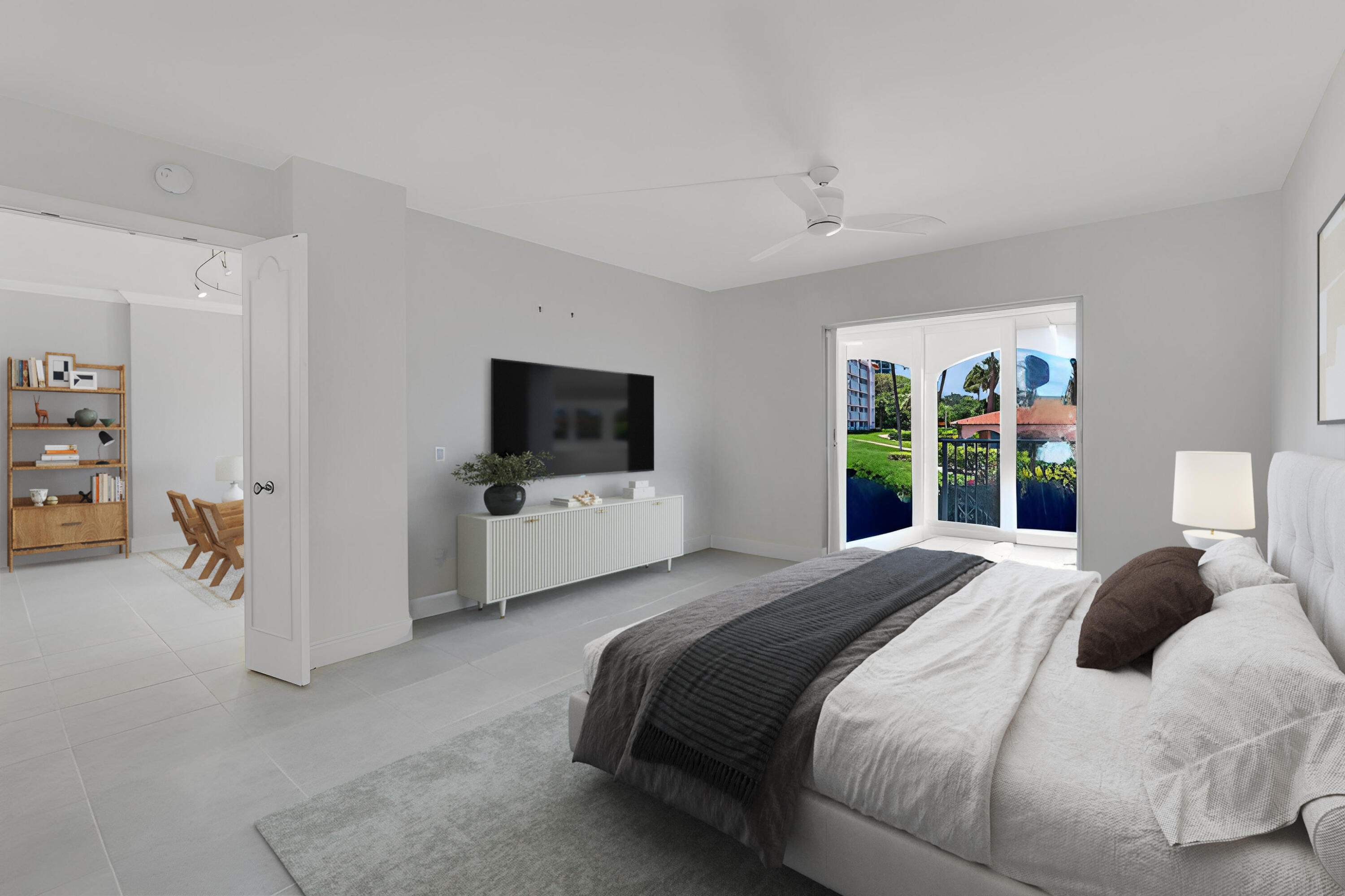 1040 Banyan Road, Unit 3050 Boca Raton, FL 33432 - Photo 20 of 35 a bedroom with a bed and a flat screen tv