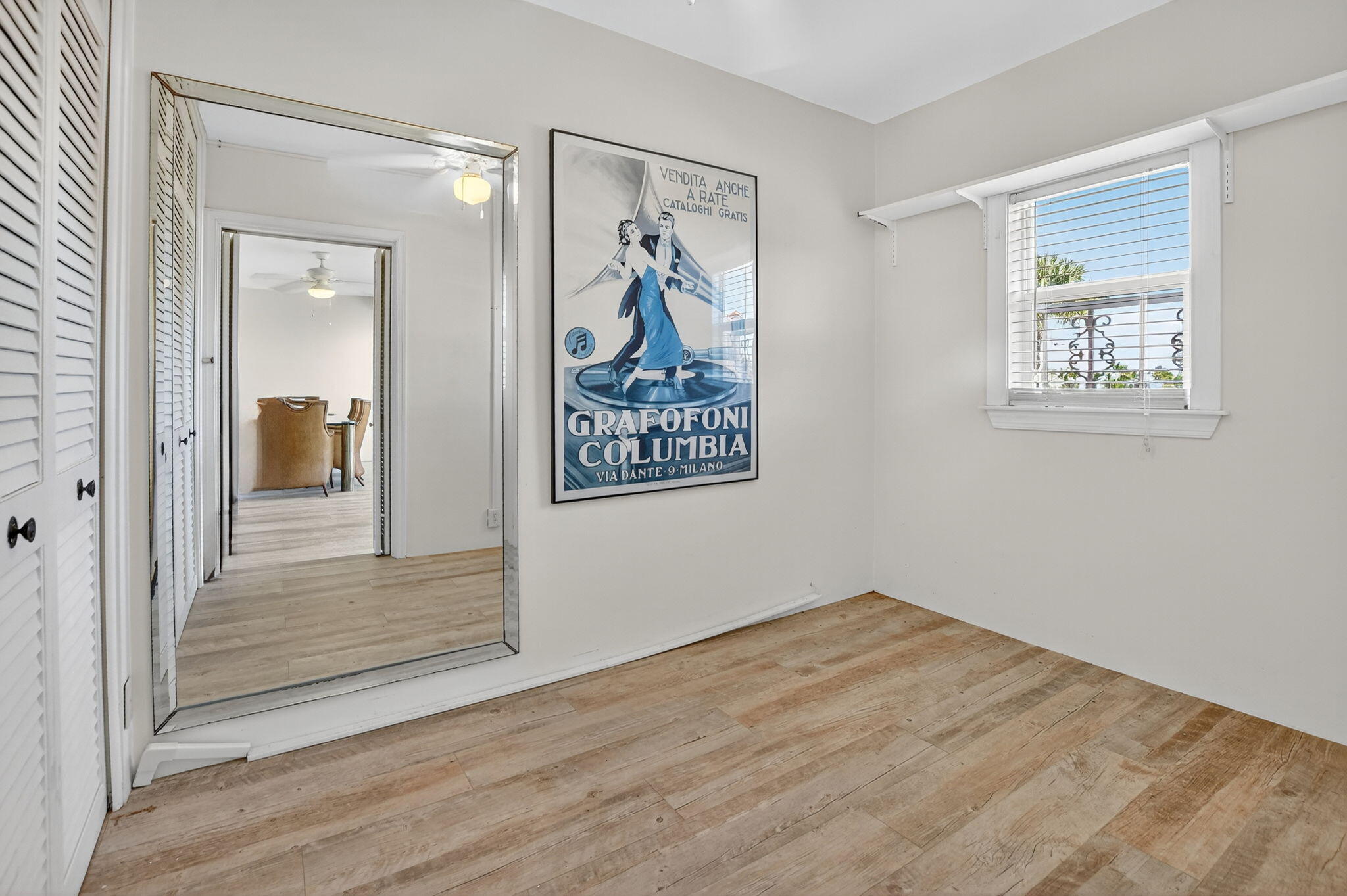 1040 Banyan Road, Unit 3050 Boca Raton, FL 33432 - Photo 29 of 35 a view of wooden floor chandelier and closet in a room