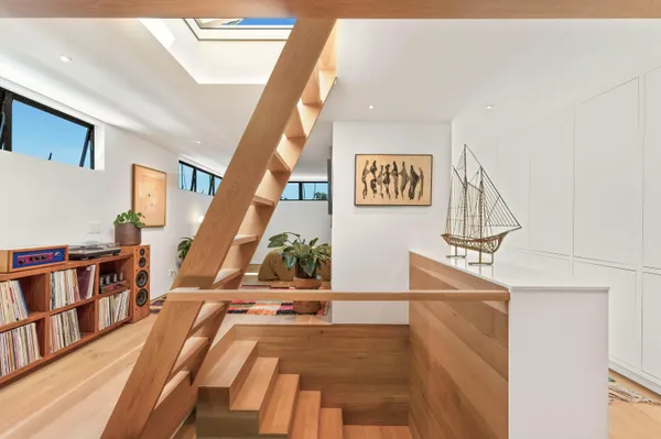 a view of an entryway with wooden floor