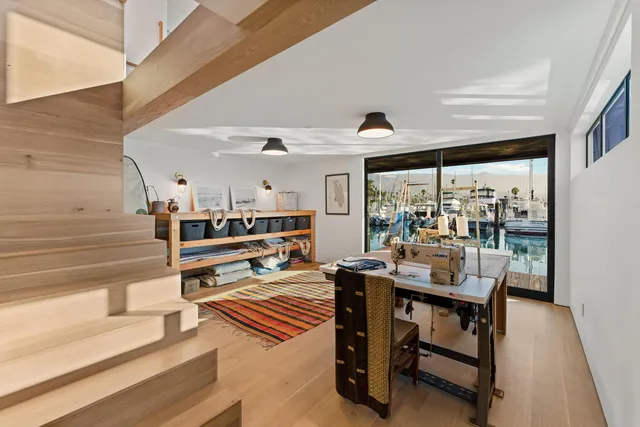 a living room with lots of furniture and a table