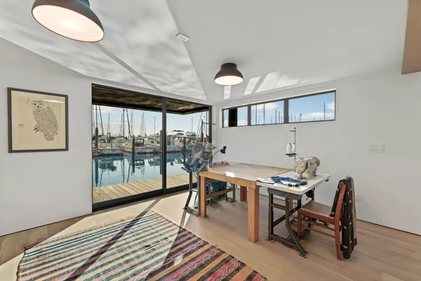 a workspace with furniture window and wooden floor