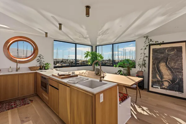 a kitchen with a sink a counter space and appliances