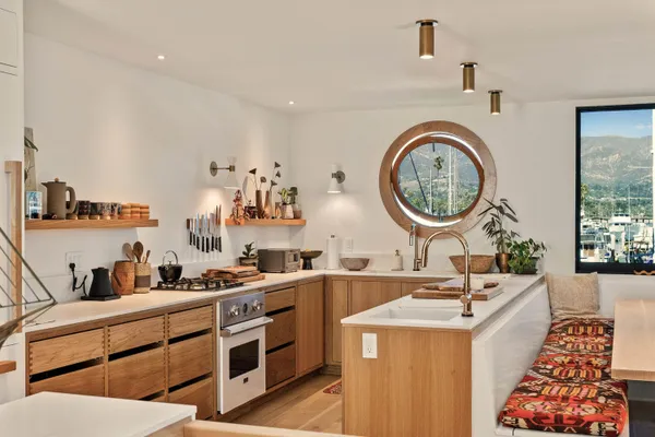 a kitchen with a sink stove and cabinets