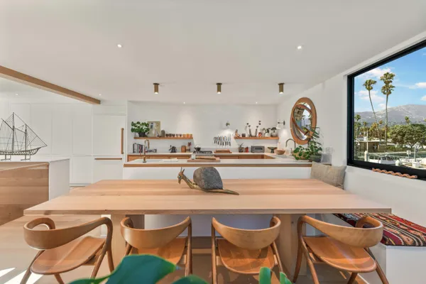 a kitchen with a table and chairs in it
