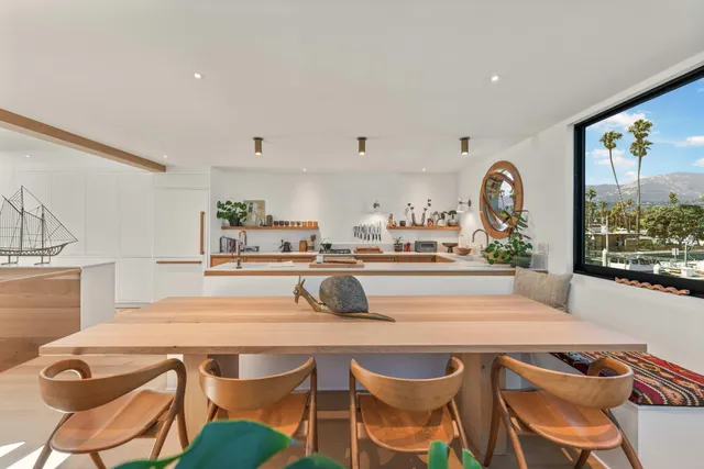 a kitchen with a table and chairs in it