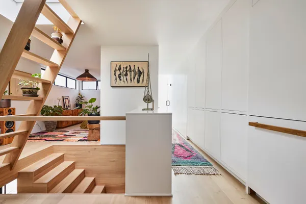 a view of kitchen with furniture and wooden floor