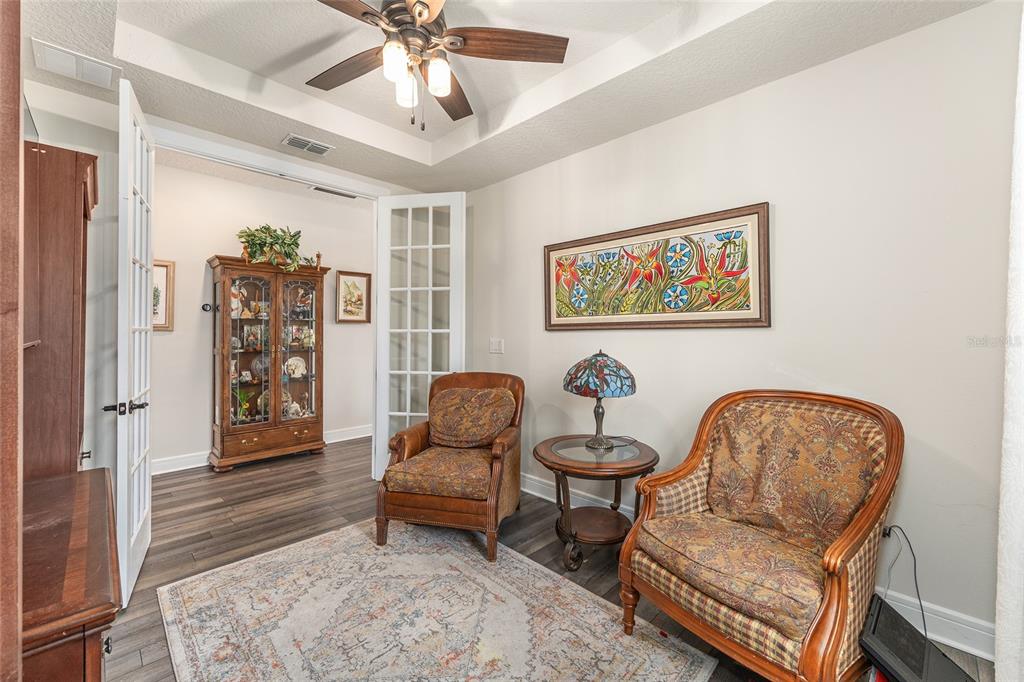8986 Southwest 58th Street Road Ocala, FL 34481 - Photo 22 of 53 a living room with furniture and a window