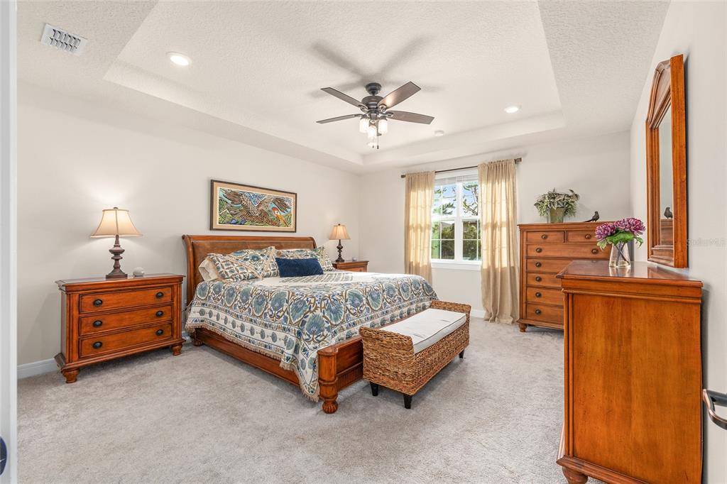 8986 Southwest 58th Street Road Ocala, FL 34481 - Photo 23 of 53 a bed room with a bed and furniture