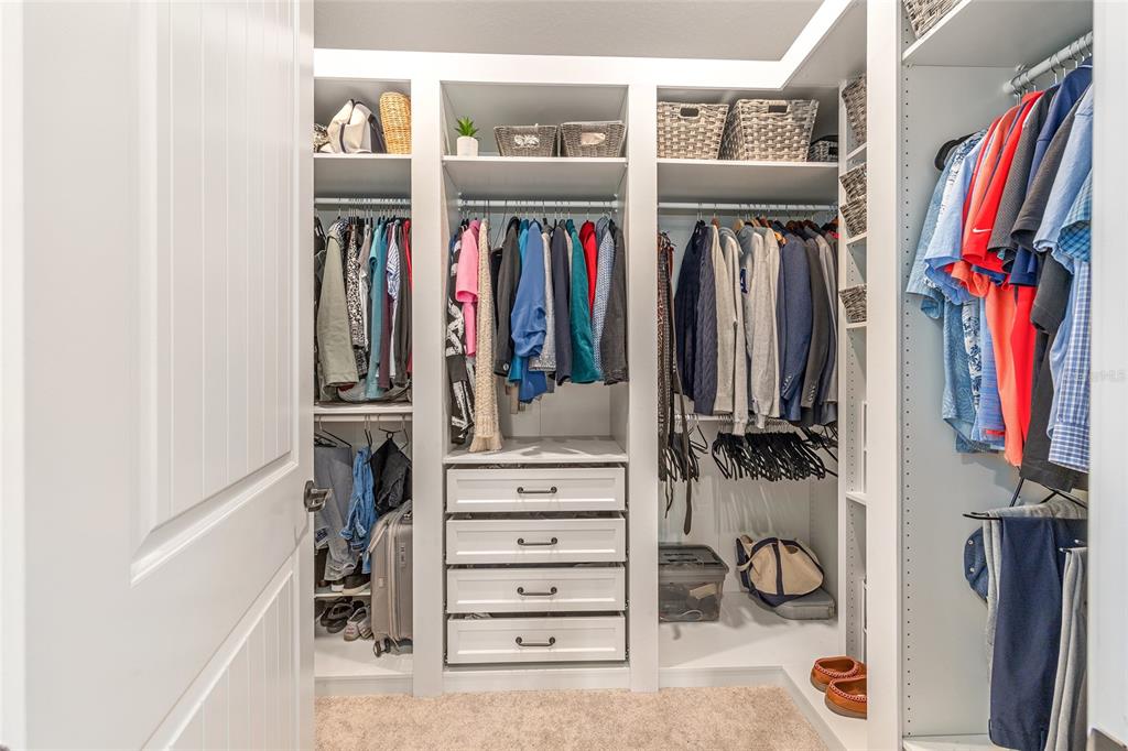 8986 Southwest 58th Street Road Ocala, FL 34481 - Photo 28 of 53 a view of walk in closet with clothes and shoes