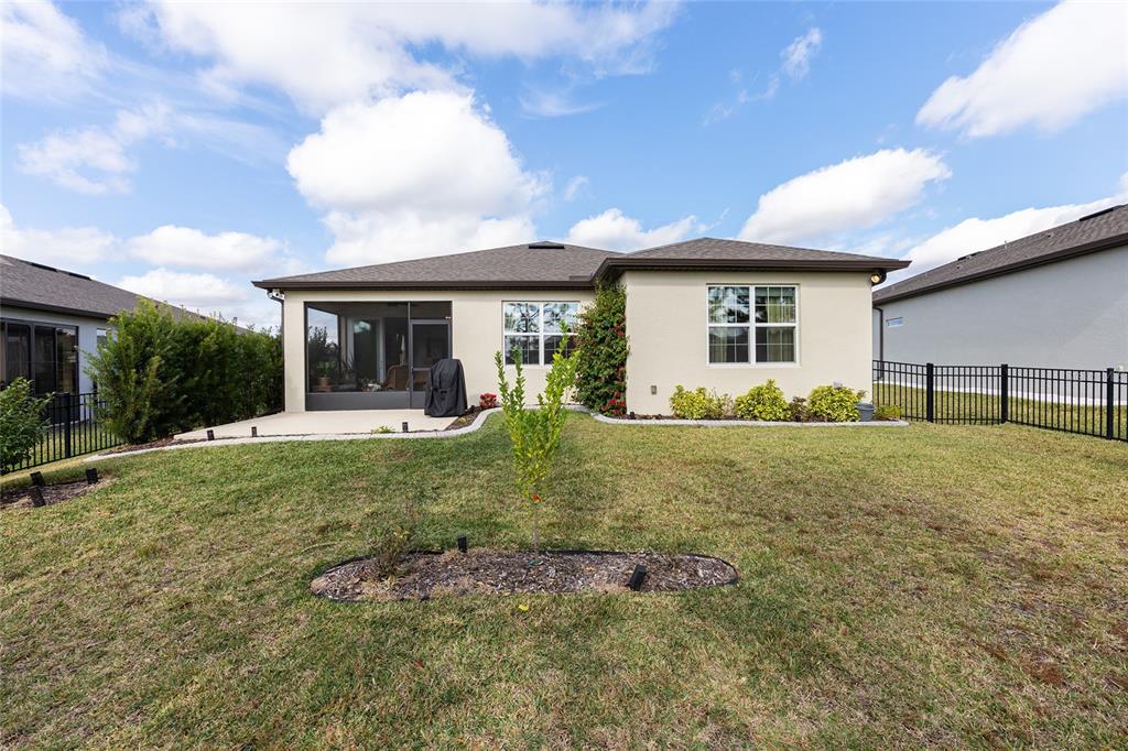 8986 Southwest 58th Street Road Ocala, FL 34481 - Photo 39 of 53 a view of a house with backyard and a tree