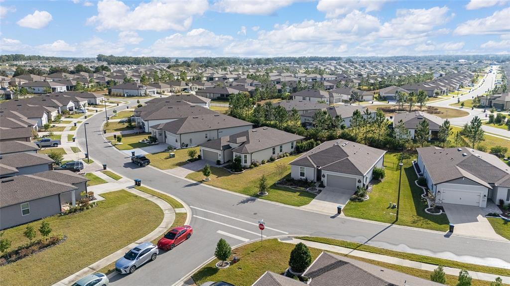8986 Southwest 58th Street Road Ocala, FL 34481 - Photo 44 of 53 an aerial view of residential houses with outdoor space