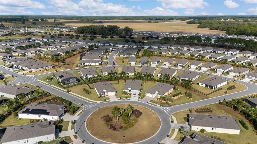 8986 Southwest 58th Street Road Ocala, FL 34481 - Photo 45 of 53 an aerial view of a residential building and lake view