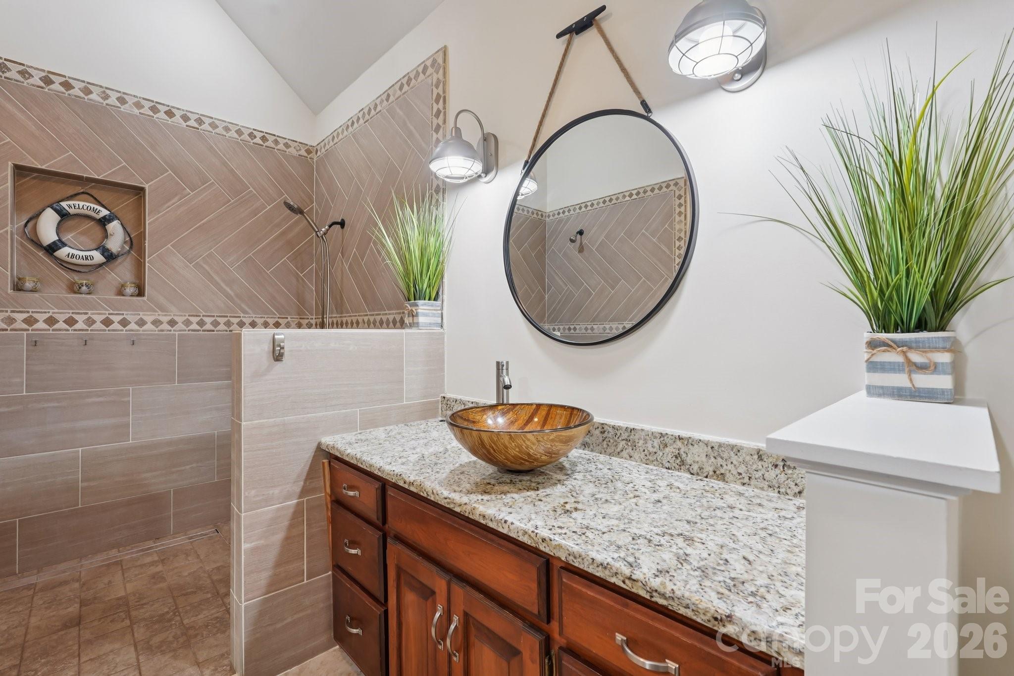 11655 Terrill Ridge Drive Davidson, NC 28036 - Photo 20 of 40 a bathroom with a granite countertop sink and a mirror