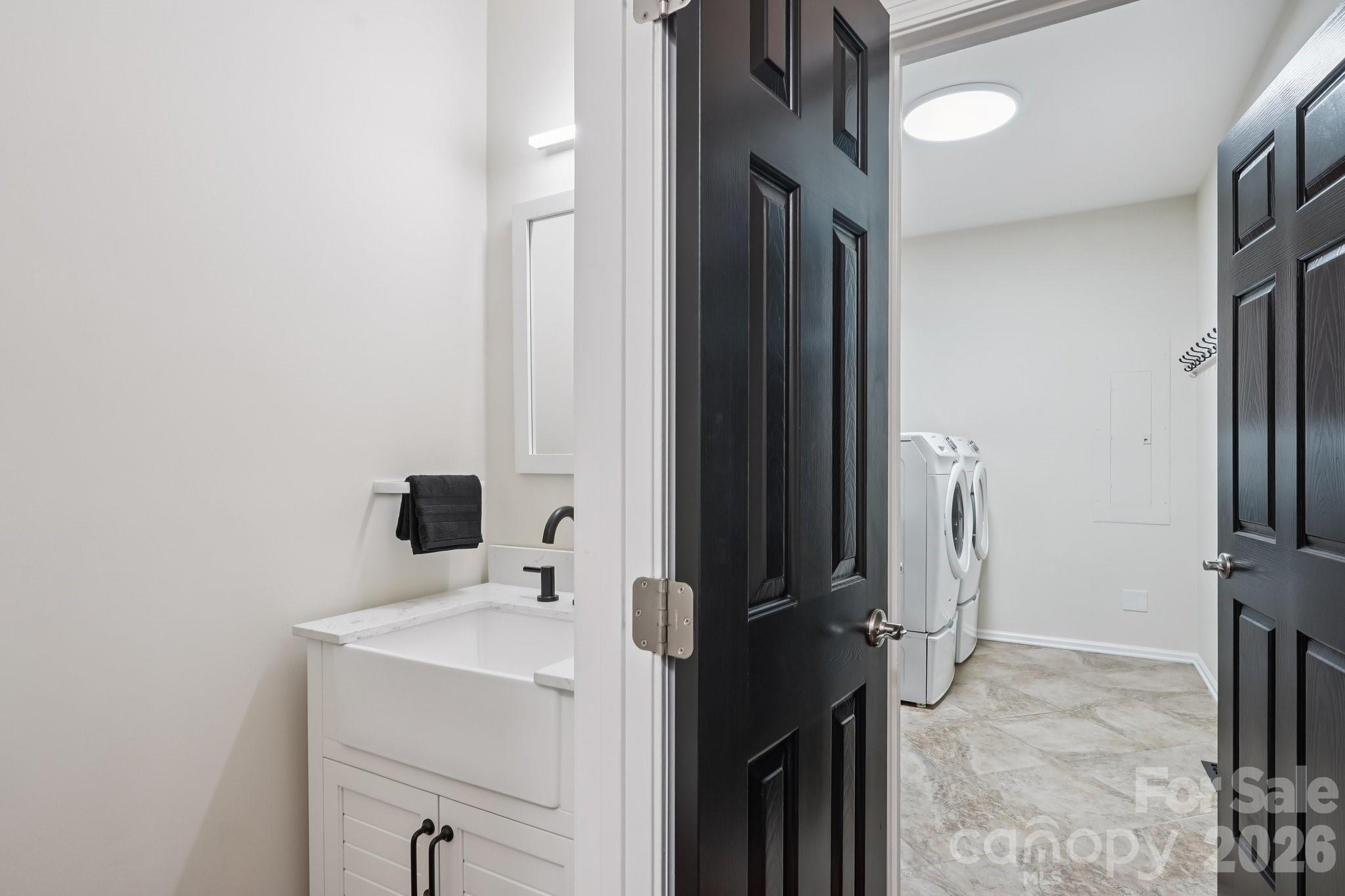 11655 Terrill Ridge Drive Davidson, NC 28036 - Photo 23 of 40 a bathroom with a sink and a mirror
