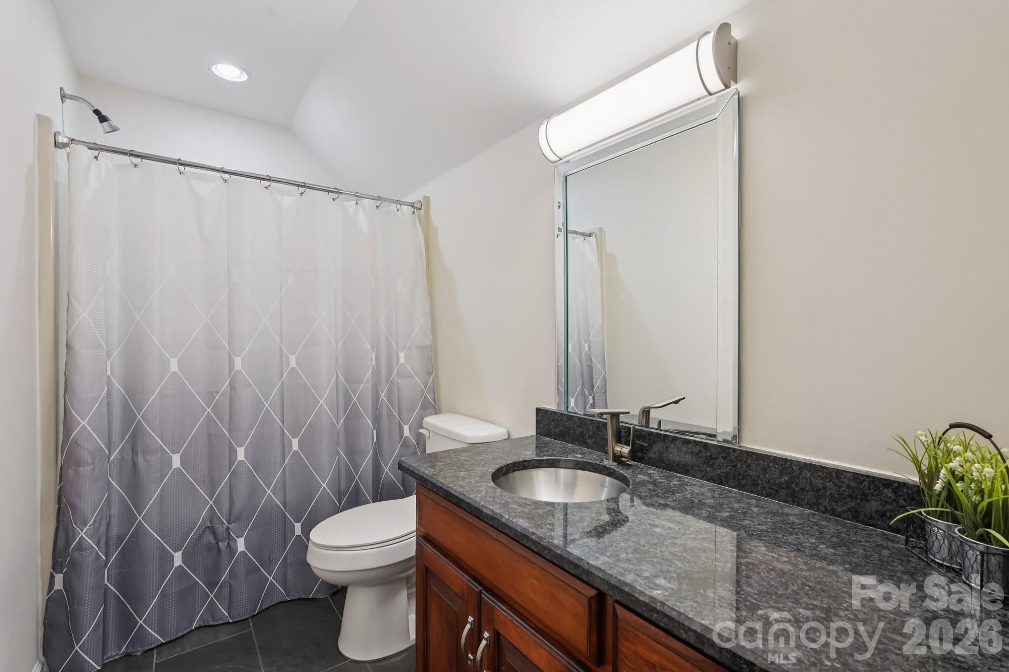 11655 Terrill Ridge Drive Davidson, NC 28036 - Photo 29 of 40 a bathroom with a granite countertop sink and a toilet