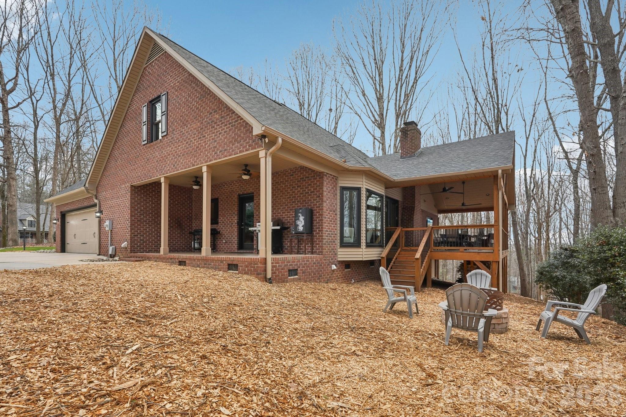 11655 Terrill Ridge Drive Davidson, NC 28036 - Photo 34 of 40 a view of a house with backyard and sitting area