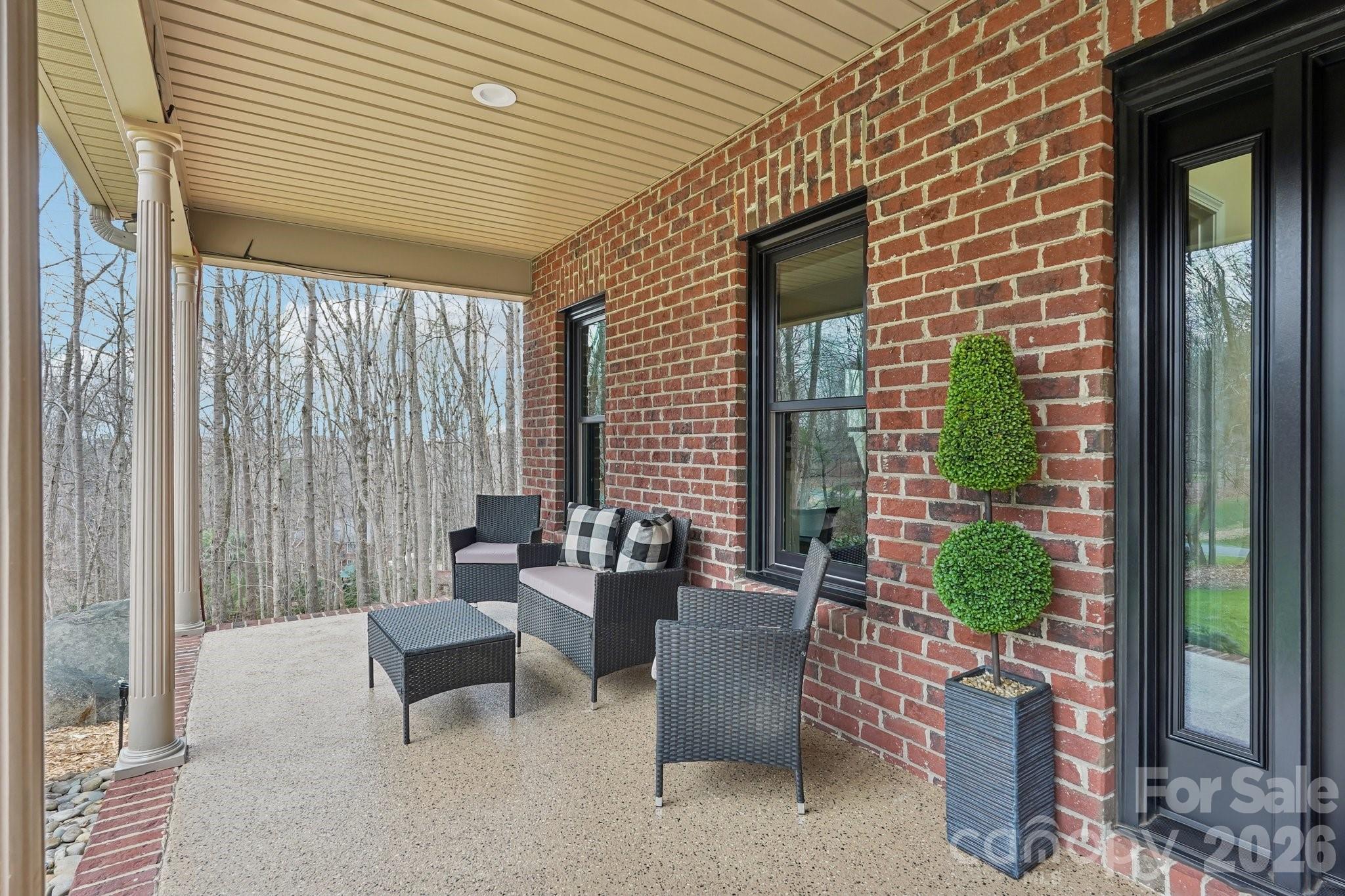 11655 Terrill Ridge Drive Davidson, NC 28036 - Photo 4 of 40 a balcony with furniture and a potted plant