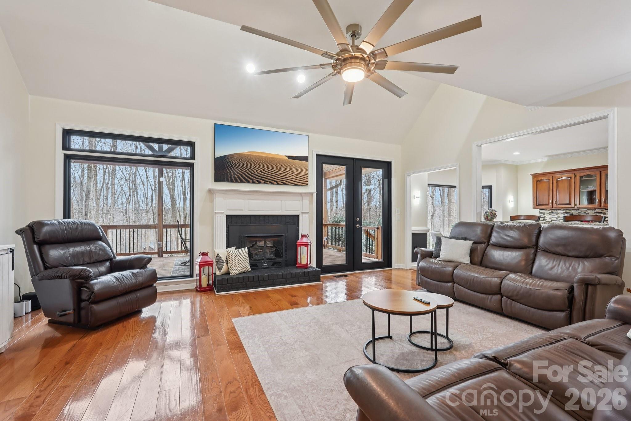 11655 Terrill Ridge Drive Davidson, NC 28036 - Photo 5 of 40 a living room with furniture fireplace and a large window
