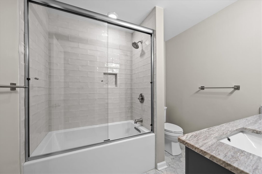 103 Satula Lane Clemson, SC 29631 - Photo 23 of 50 This modern bathroom features a sleek shower-tub combo and a functional vanity with elegant countertops.