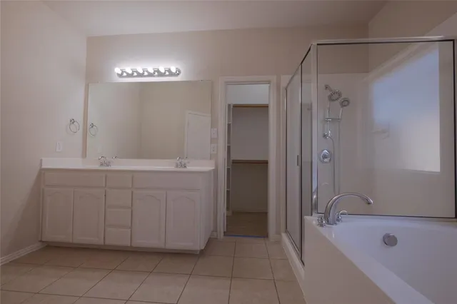 a bathroom with a bathtub and a sink