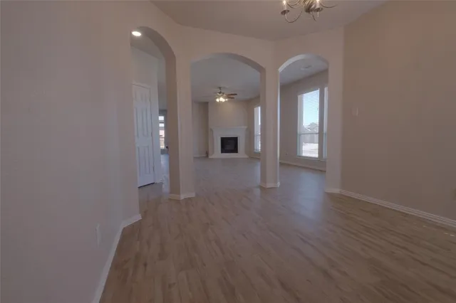 wooden floor in a hall with a window