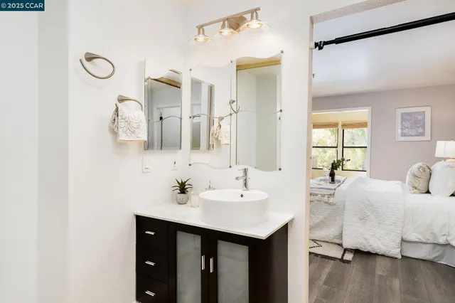 a bathroom with a shower and a sink