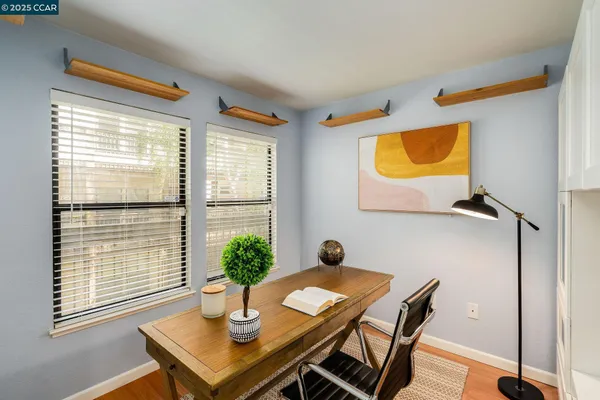 a view of a hallway with dining area
