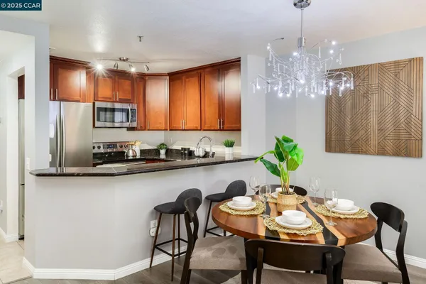 a table room with chairs and chandelier