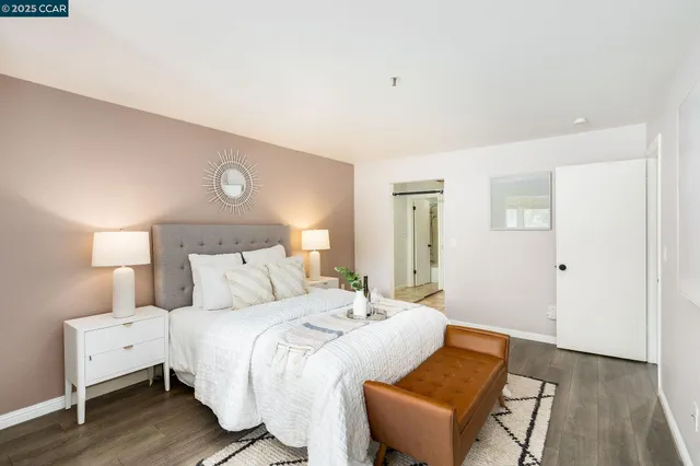 a bedroom with a bed and a couch