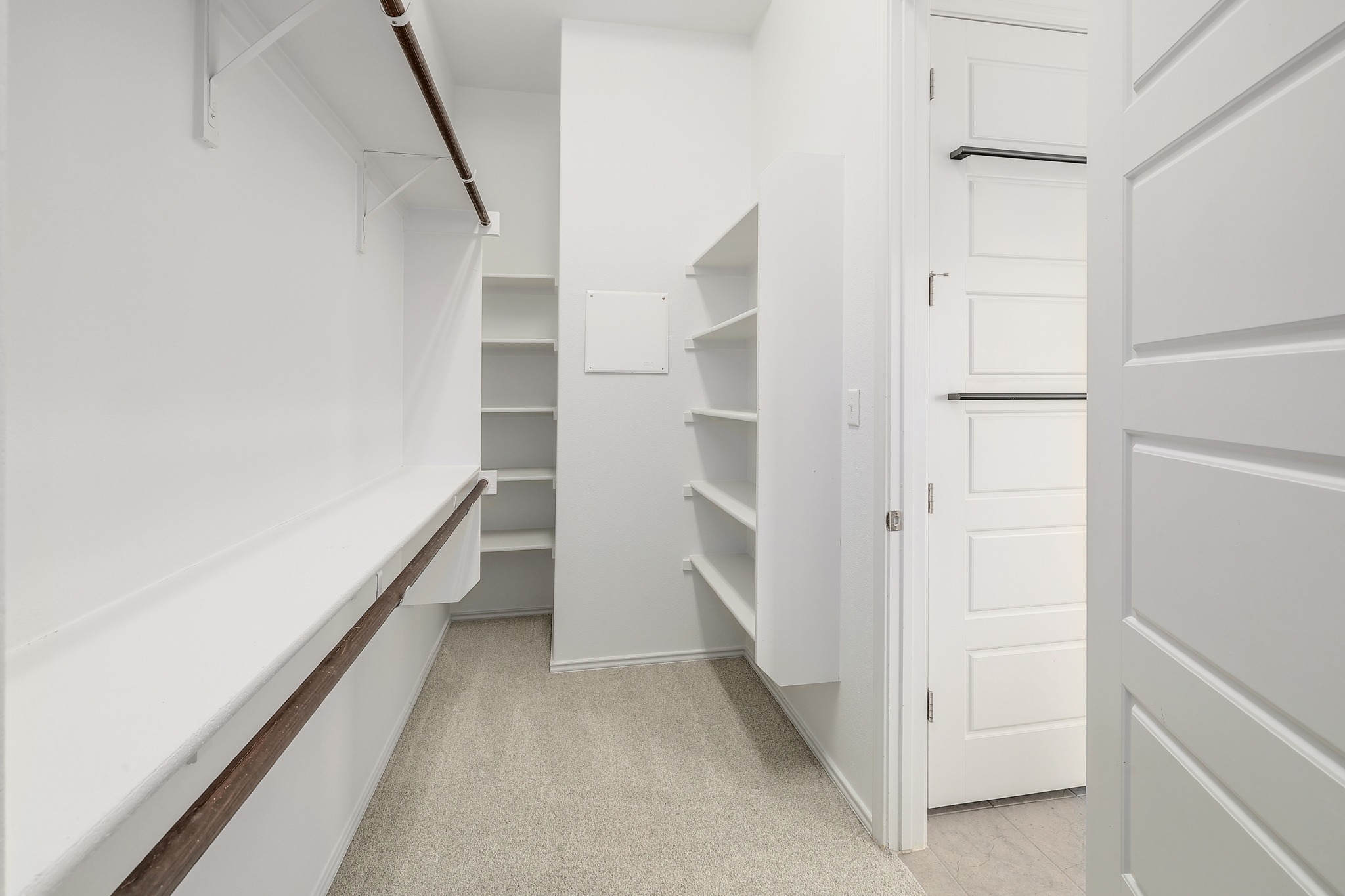 17309 Silent Harbor Loop Pflugerville, TX 78660 - Photo 17 of 38 a view of walk in closet with empty racks