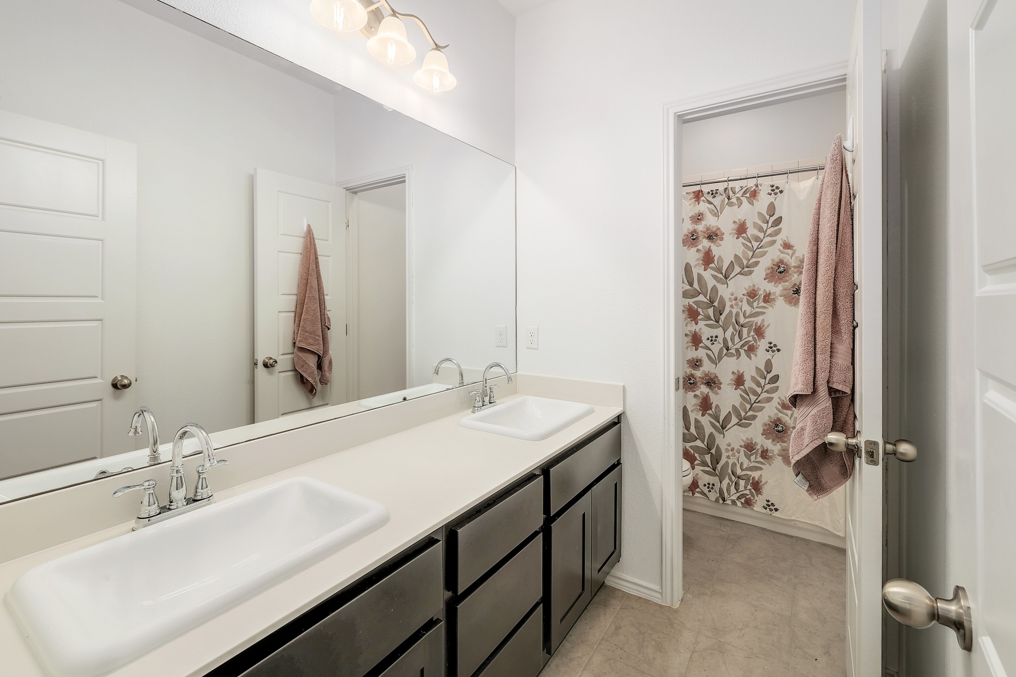 17309 Silent Harbor Loop Pflugerville, TX 78660 - Photo 23 of 38 a bathroom with a double vanity sink mirror and double