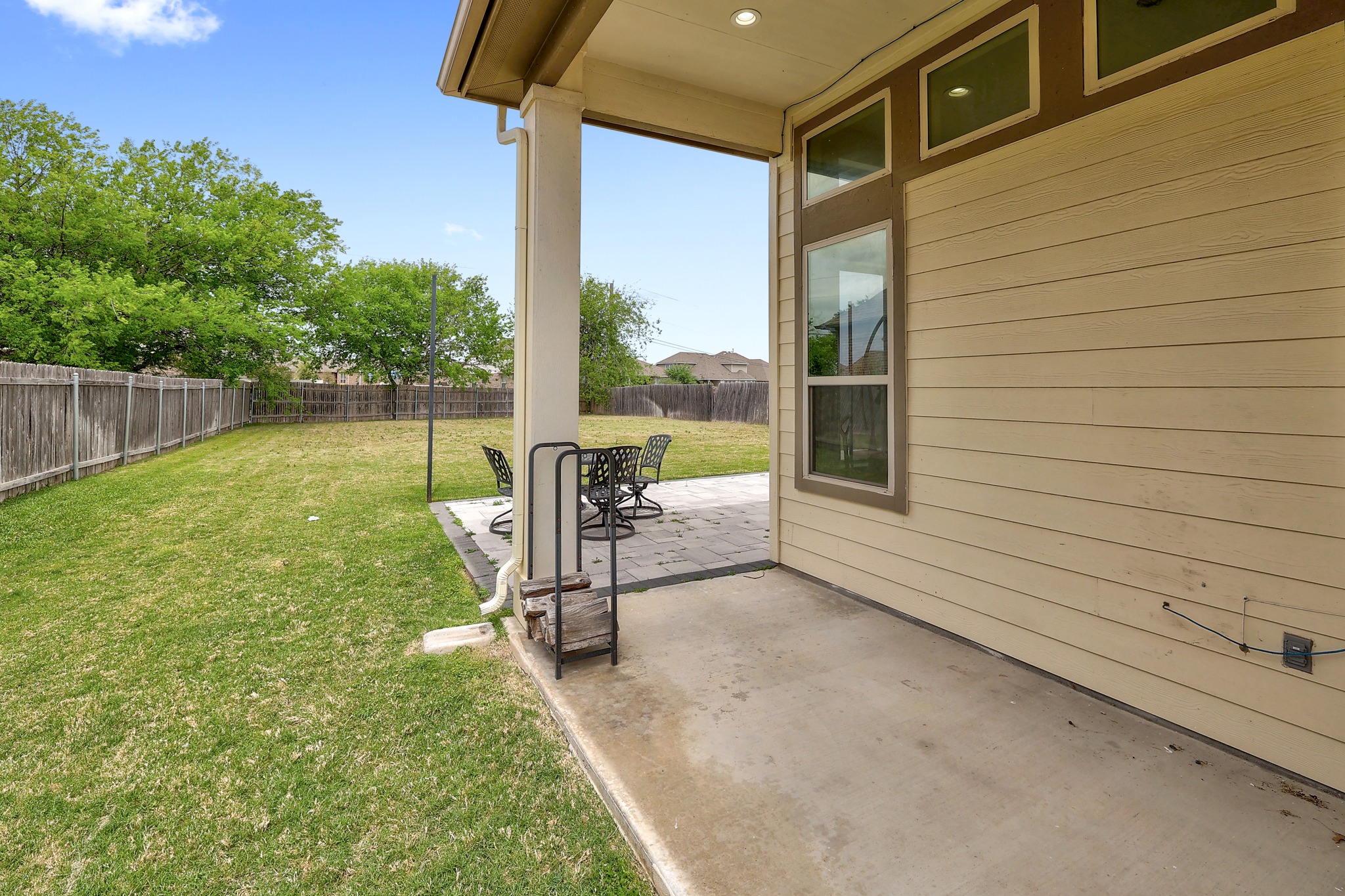 17309 Silent Harbor Loop Pflugerville, TX 78660 - Photo 31 of 38 a view of a backyard with a garden and chairs
