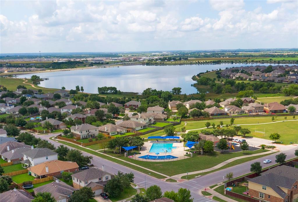 17309 Silent Harbor Loop Pflugerville, TX 78660 - Photo 34 of 38 an aerial view of a city with a lake