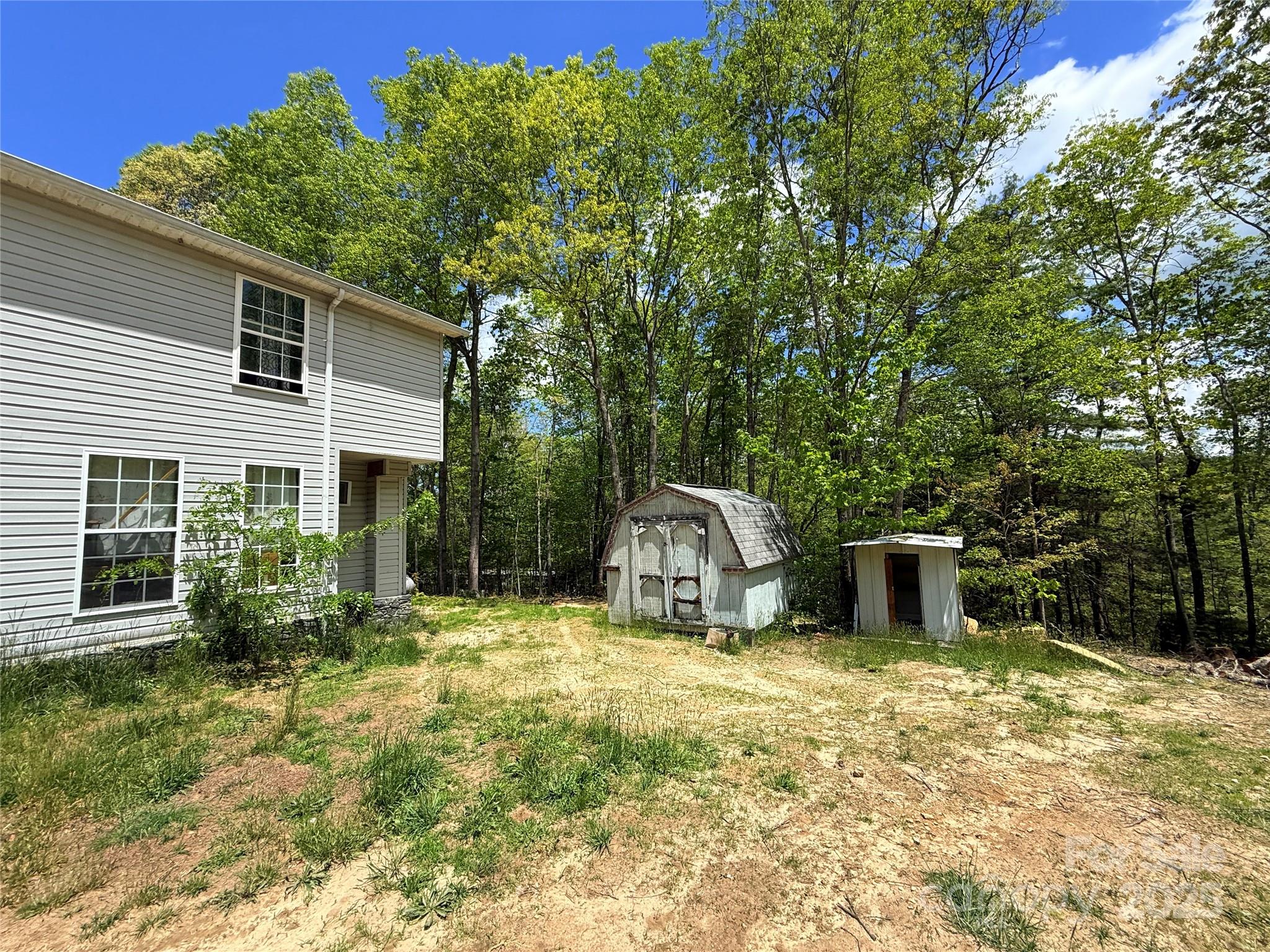 630 Deerchase Circle Cedar Mountain, NC 28718 - Photo 17 of 18 a view of a house with backyard and sitting area