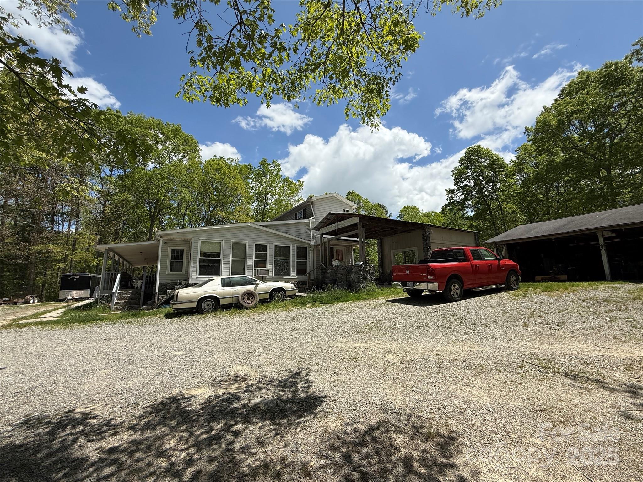 630 Deerchase Circle Cedar Mountain, NC 28718 - Photo 3 of 18 a view of a house with a yard and sitting area