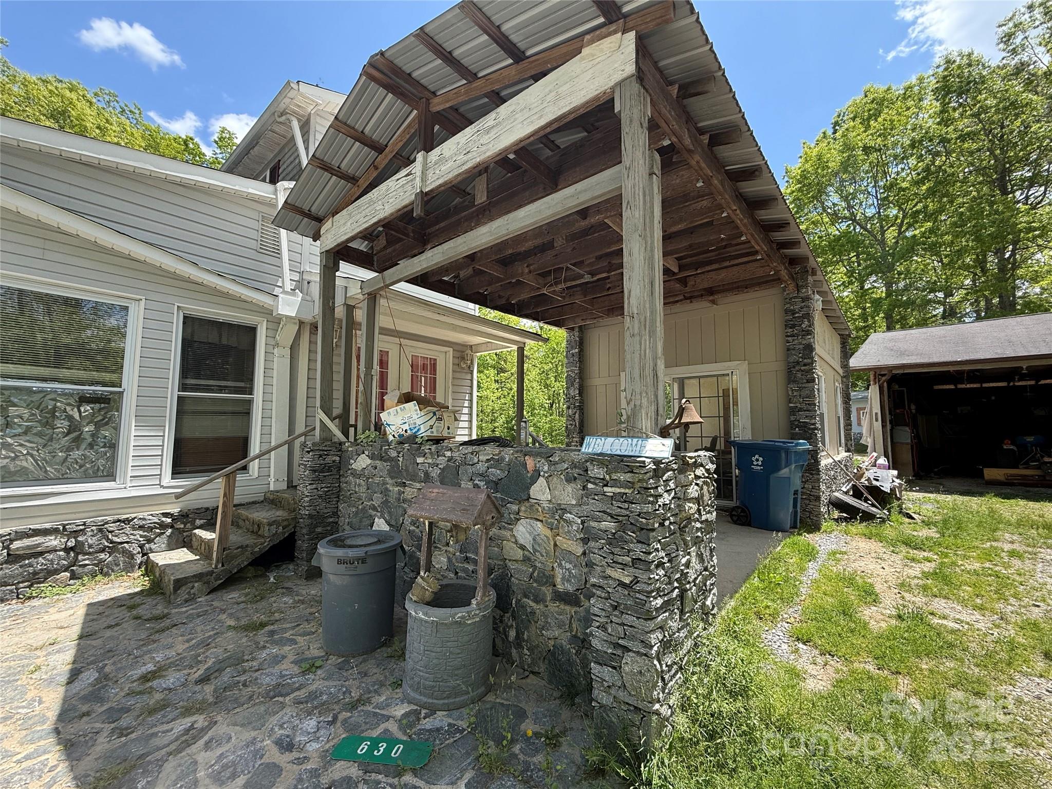 630 Deerchase Circle Cedar Mountain, NC 28718 - Photo 4 of 18 a view of a porch with furniture and a fire pit
