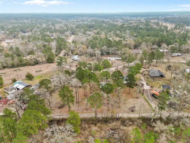 a view of a city with green field