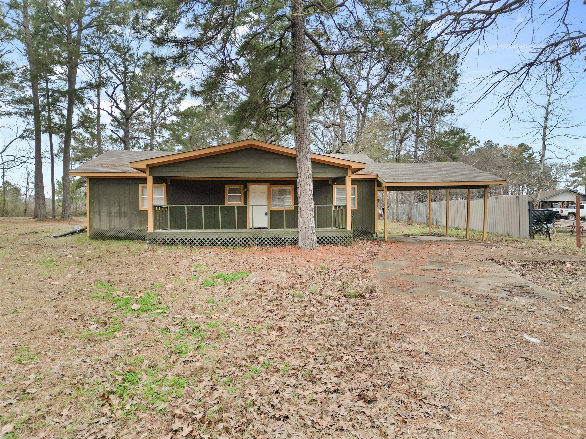 31C Jackson Road, Unit C Huntsville, TX 77320 - Photo 2 of 16 a front view of a house with a garden