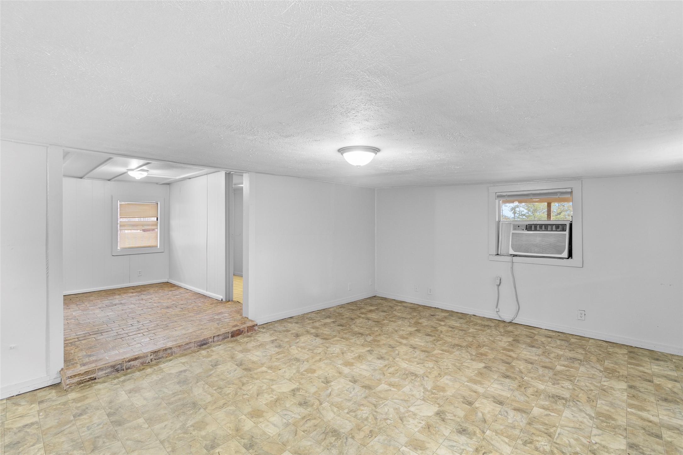 31C Jackson Road, Unit C Huntsville, TX 77320 - Photo 3 of 16 an empty room with a empty space and windows