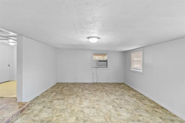 an empty room with a empty space and window