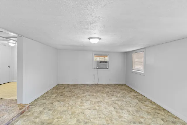 an empty room with a empty space and window