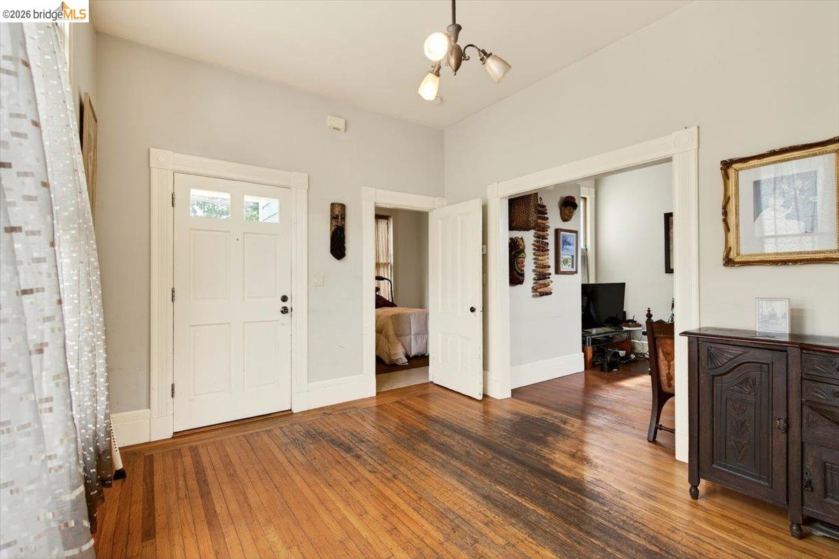 1013 Addison Street Berkeley, CA 94710 - Photo 13 of 57 Entrance foyer featuring hardwood / wood-style floors and suspended lighting