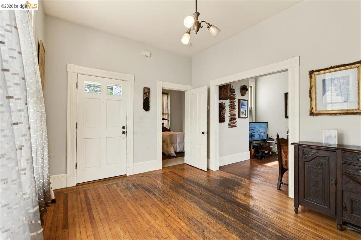 1013 Addison Street Berkeley, CA 94710 - Photo 14 of 57 Foyer with hardwood / wood-style flooring and a chandelier