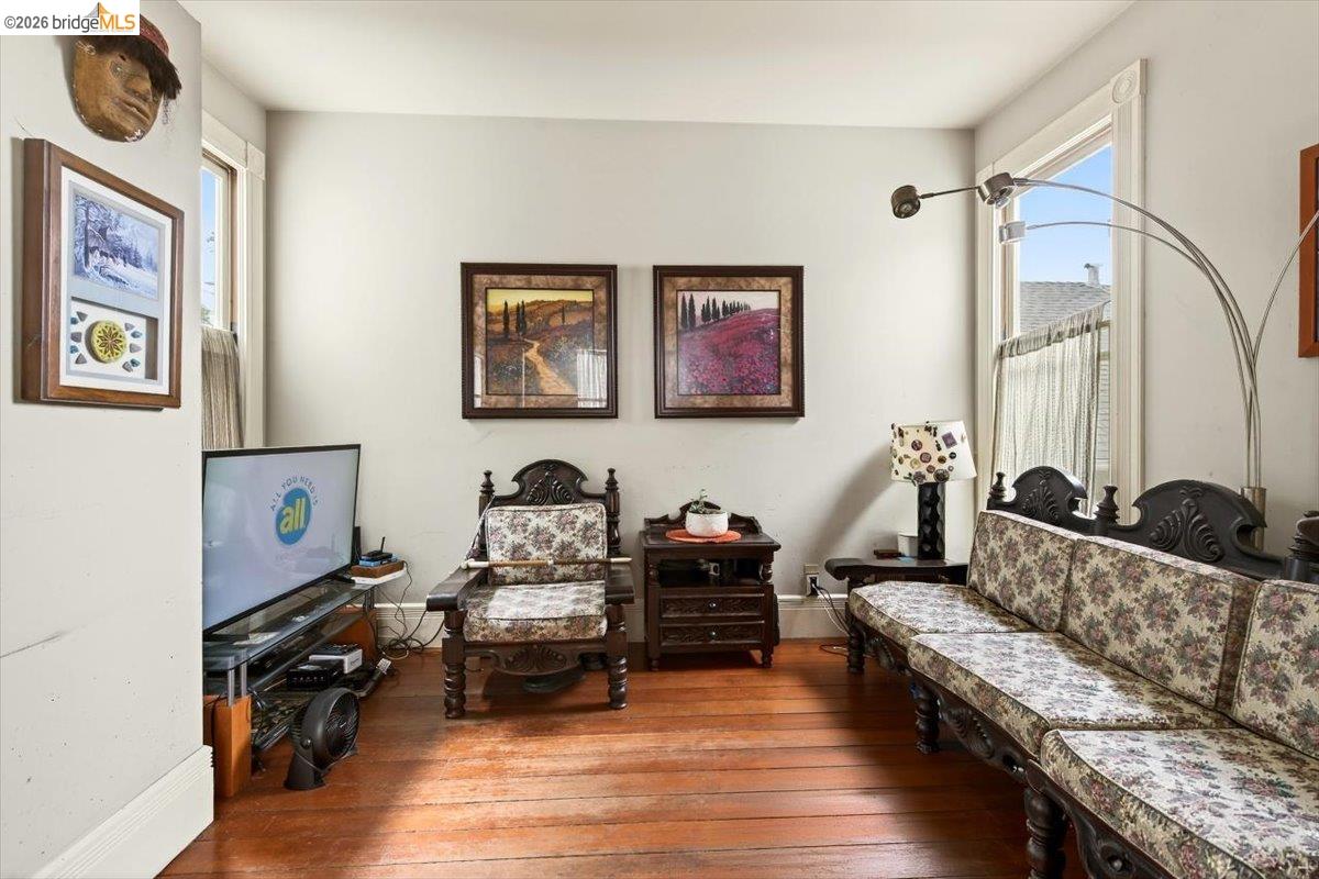 1013 Addison Street Berkeley, CA 94710 - Photo 15 of 57 Living area featuring hardwood / wood-style floors and baseboards