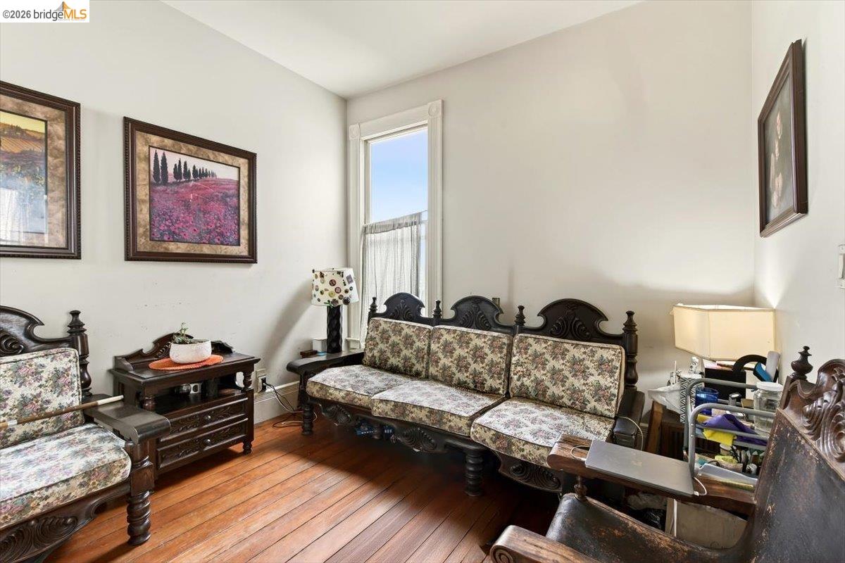 1013 Addison Street Berkeley, CA 94710 - Photo 16 of 57 Living area featuring hardwood / wood-style flooring and baseboards